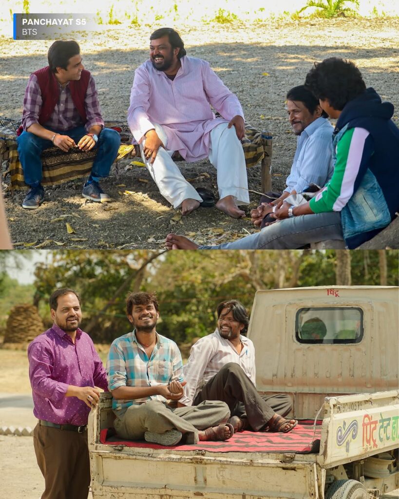 Jitendra Kumar in a blue shirt smiling while holding the Panchayat Season 5 clapboard in Phulera village