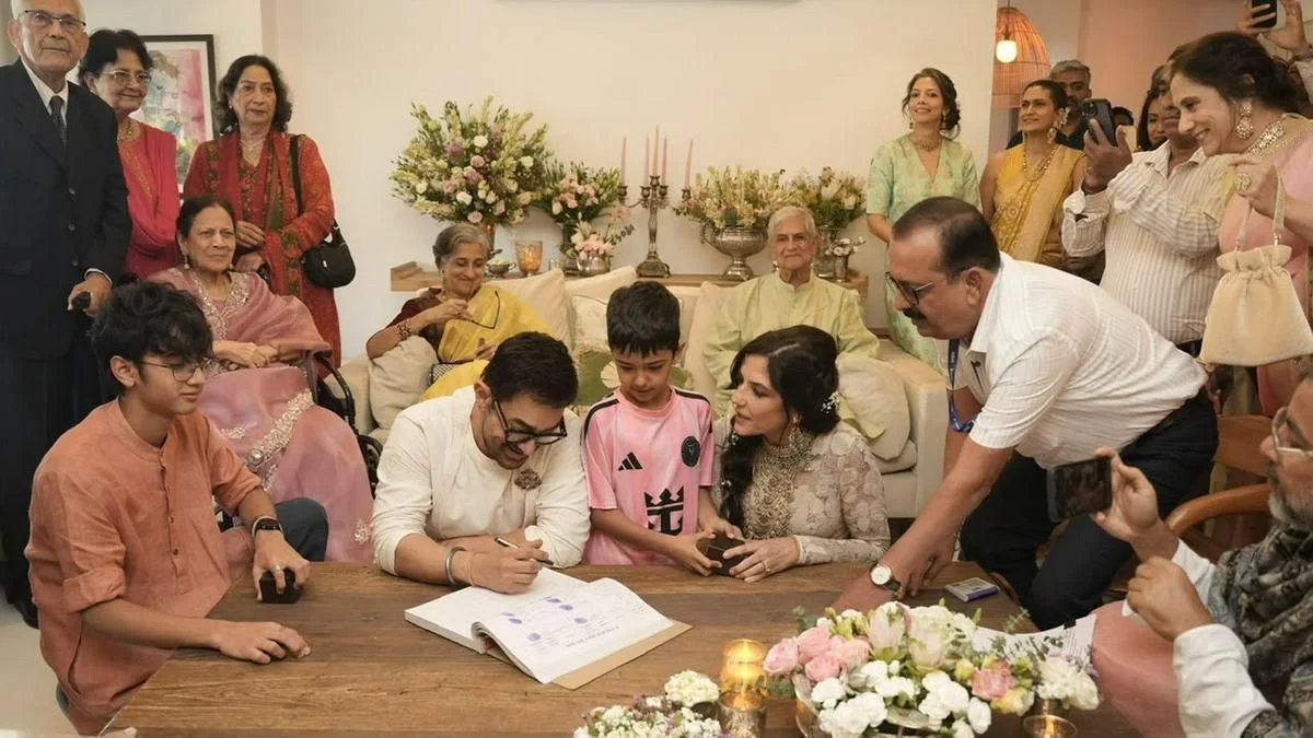 Aamir Khan and Gauri Spratt signing marriage registry at their private Mumbai wedding